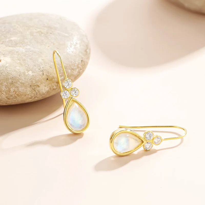 Gold moonstone earrings with teardrop moonstones and three clear diamond cz stones