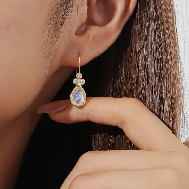 Gold moonstone earrings with teardrop moonstones and three clear diamond cz stones