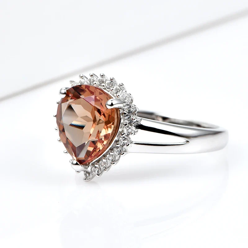 Silver zultanite ring with a pear-shaped zultanite and clear cz stones