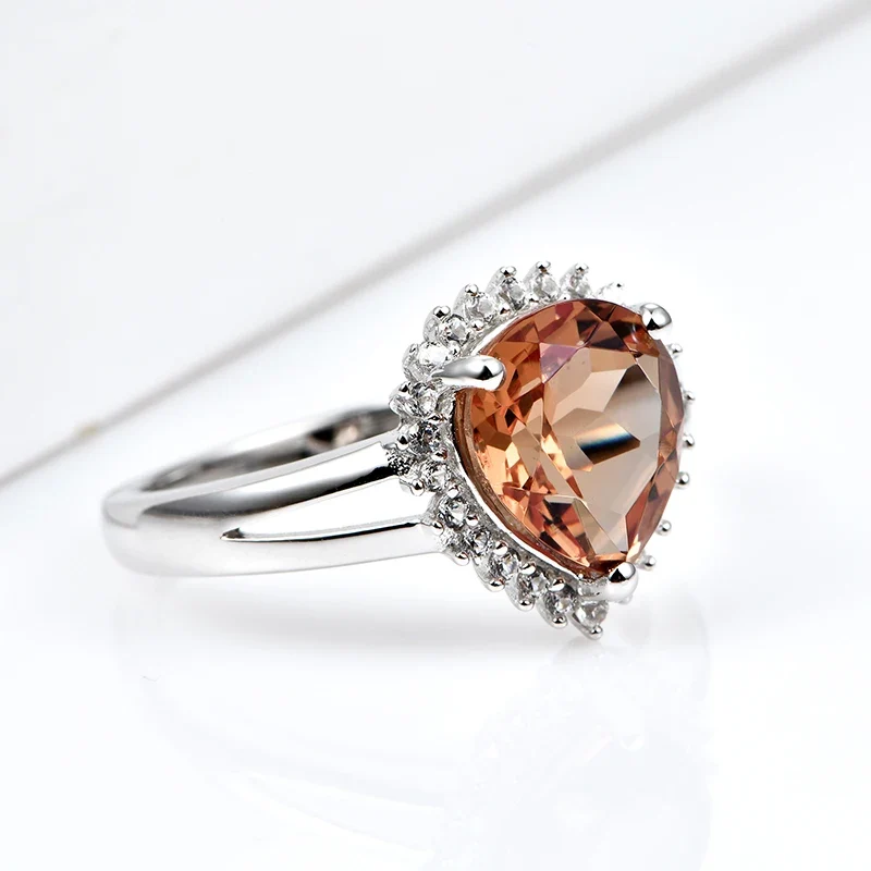 Silver zultanite ring with a pear-shaped zultanite and clear cz stones