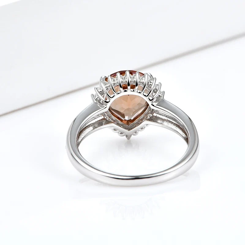 Silver zultanite ring with a pear-shaped zultanite and clear cz stones
