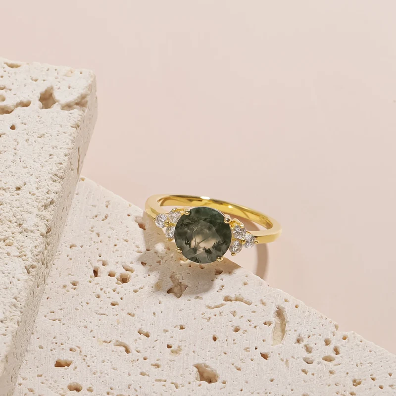 Moss agate ring with a round moss agate and three cz on each side gold promise ring