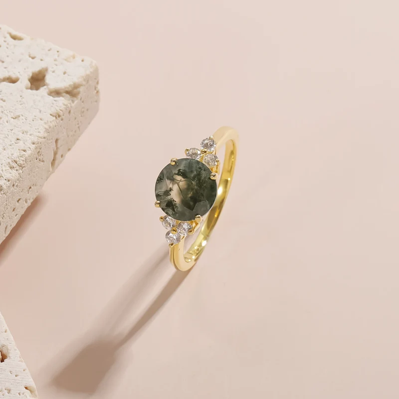 Moss agate ring with a round moss agate and three cz on each side gold promise ring