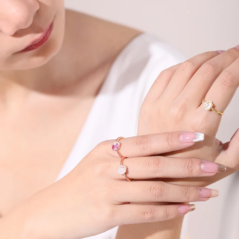 Rose gold moonstone ring with clear cz arranged in a half circle wedding ring for women
