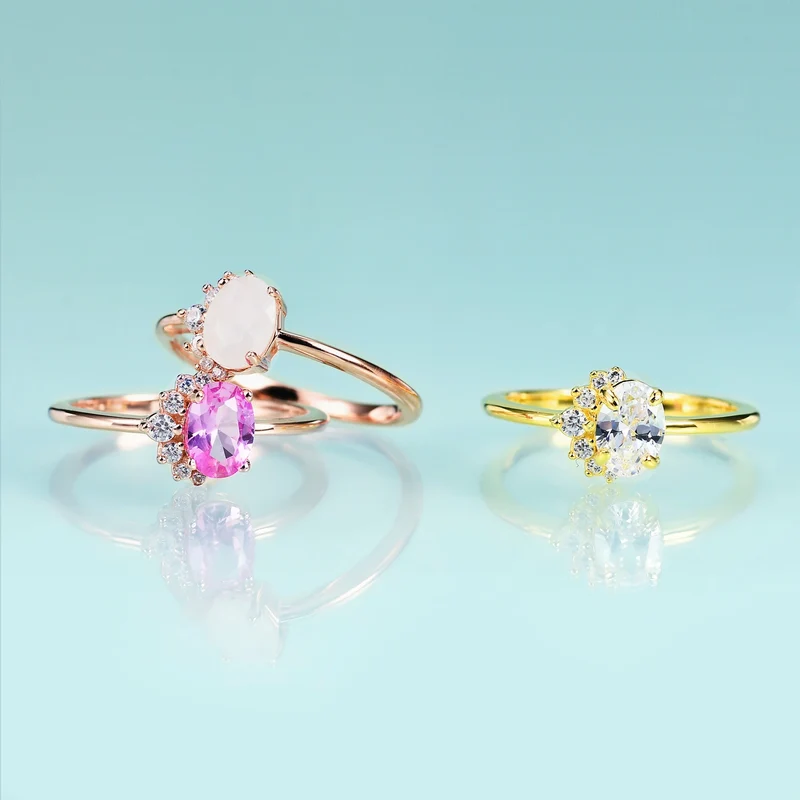 Rose gold moonstone ring with clear cz arranged in a half circle wedding ring for women