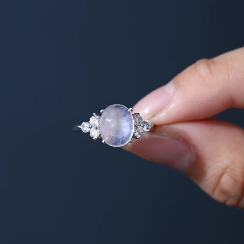 Silver moonstone ring with an oval moonstone and clear diamond cz