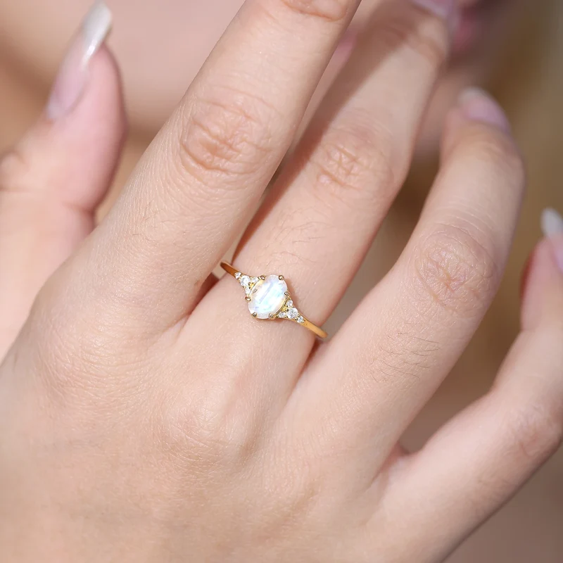 Moonstone and diamond engagement ring with an oval moonstone