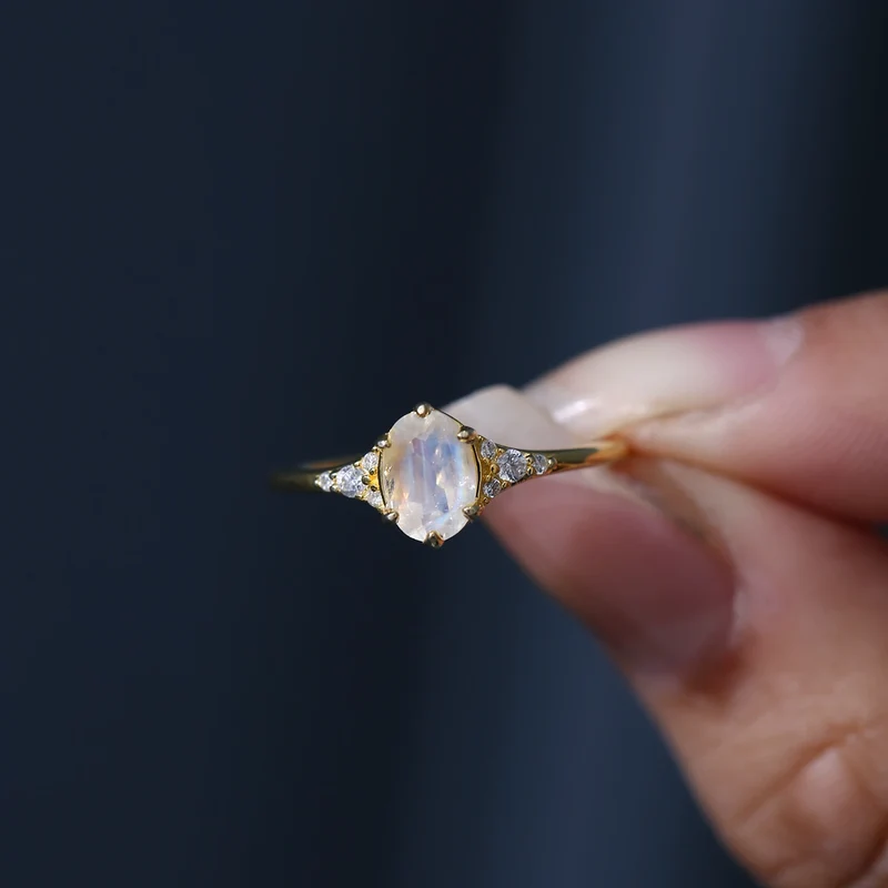Moonstone and diamond engagement ring with an oval moonstone