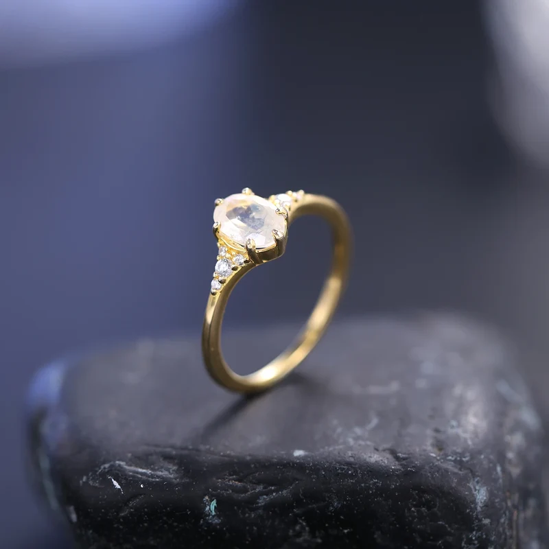 Moonstone and diamond engagement ring with an oval moonstone