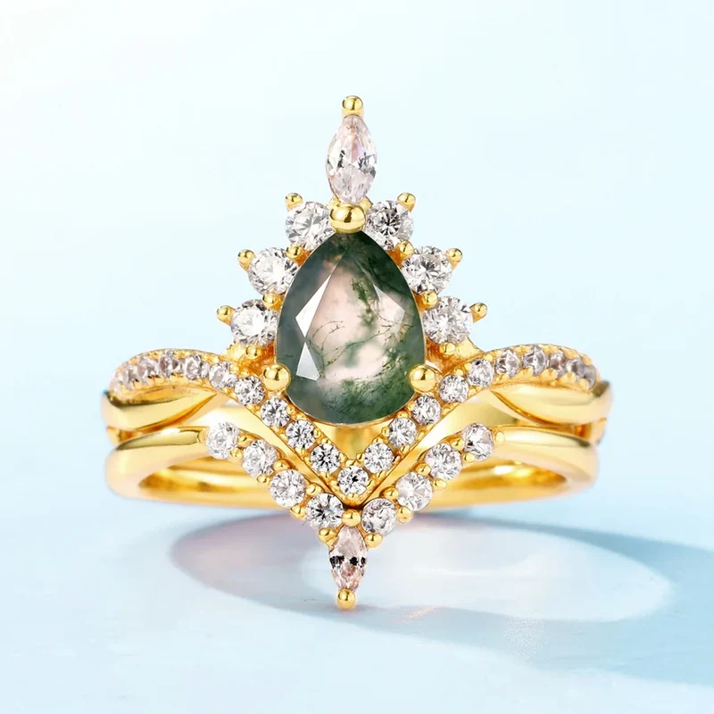 Moss agate wedding ring set with a pear-shaped moss agate sterling silver
