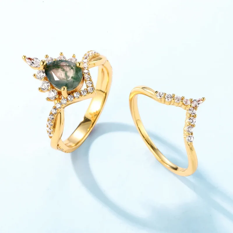 Moss agate wedding ring set with a pear-shaped moss agate sterling silver