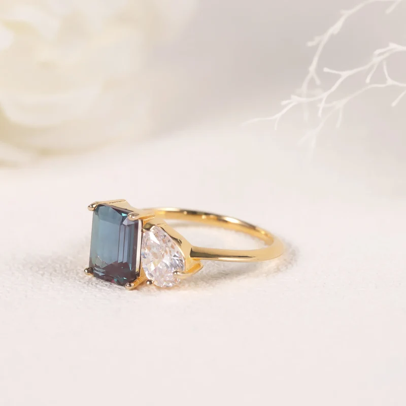 You and me ring with a color-changing alexandrite stone and a clear cz