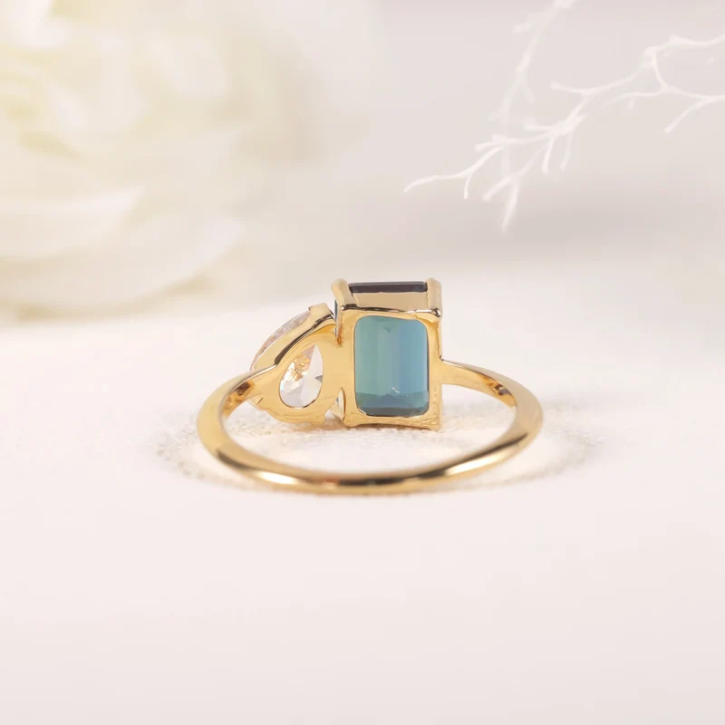 You and me ring with a color-changing alexandrite stone and a clear cz