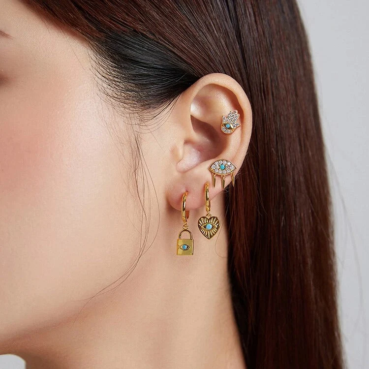 Evil eye and lock earring