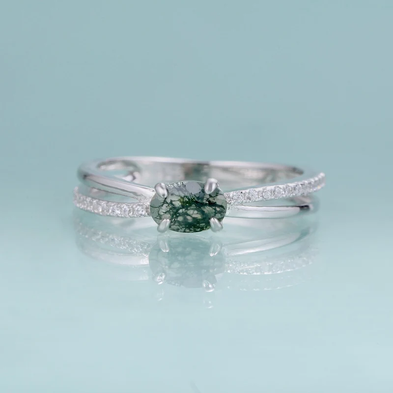 Moss agate wedding ring with a cross-shaped design in silver
