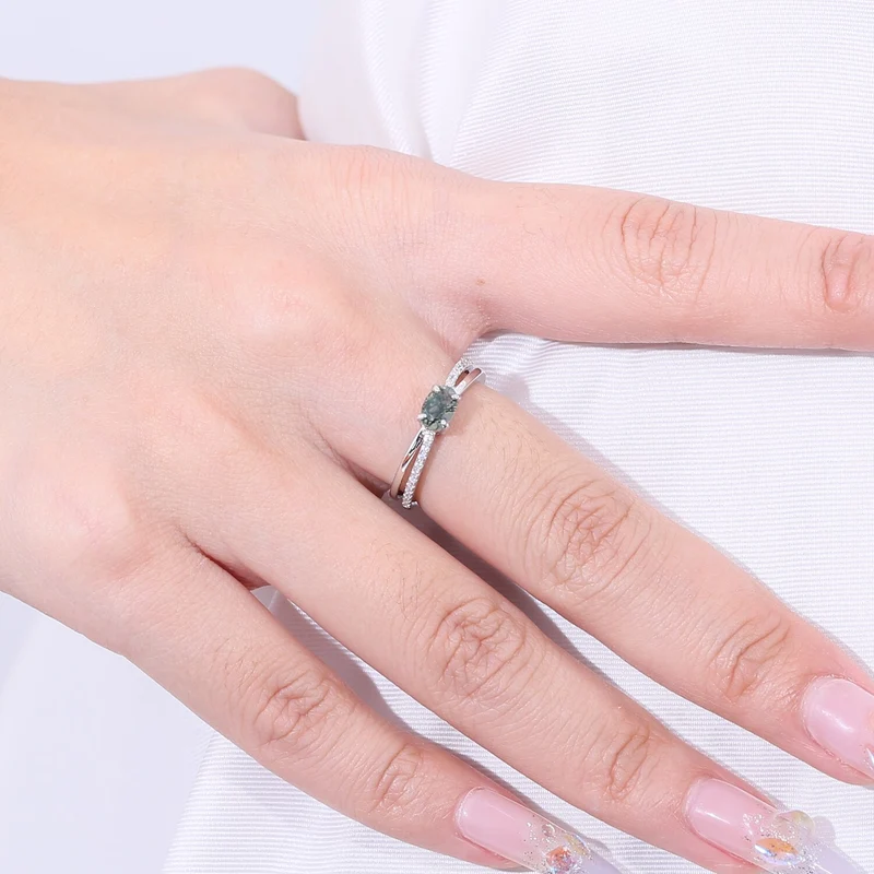 Moss agate wedding ring with a cross-shaped design in silver