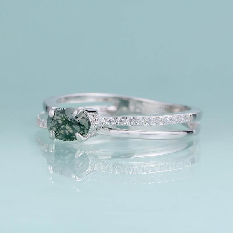 Moss agate wedding ring with a cross-shaped design in silver