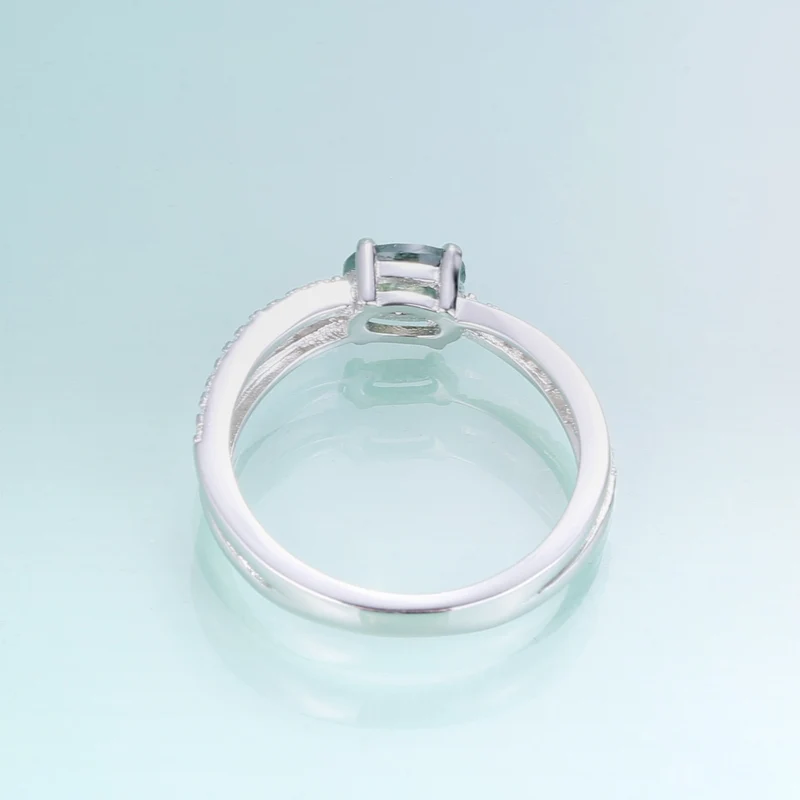 Moss agate wedding ring with a cross-shaped design in silver