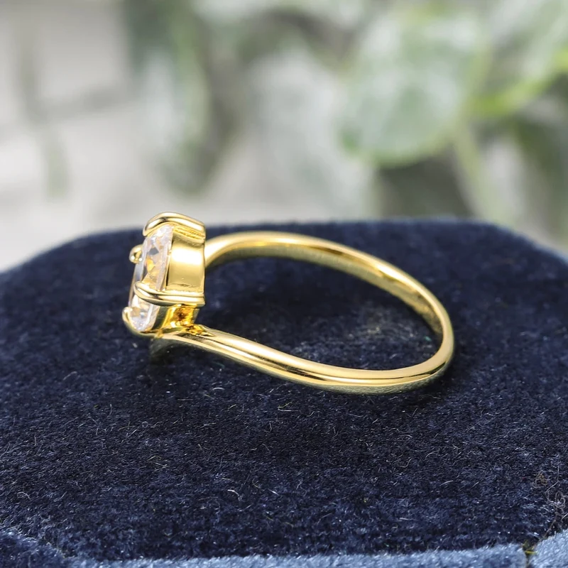 Curved moissanite wedding band oval cut