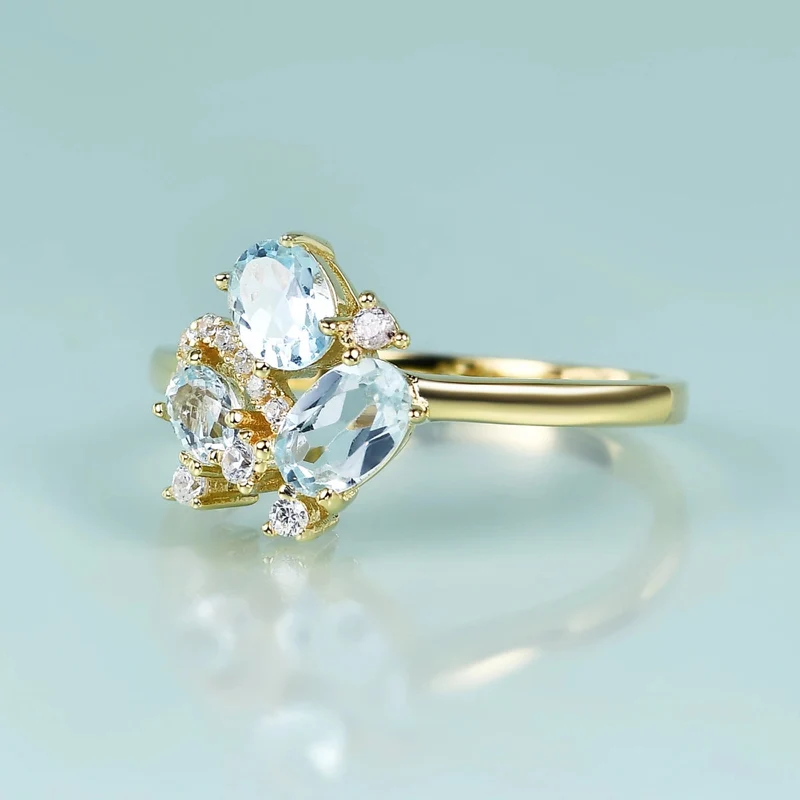 Three-stone blue topaz ring