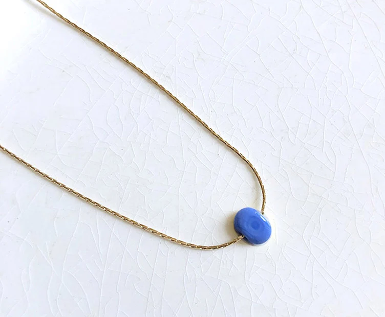 Collier Bim doré et verre opaque bleu